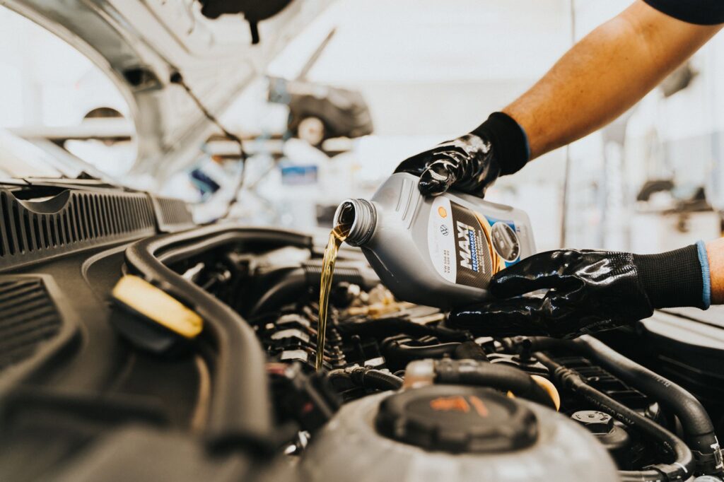 pouring oil to engine