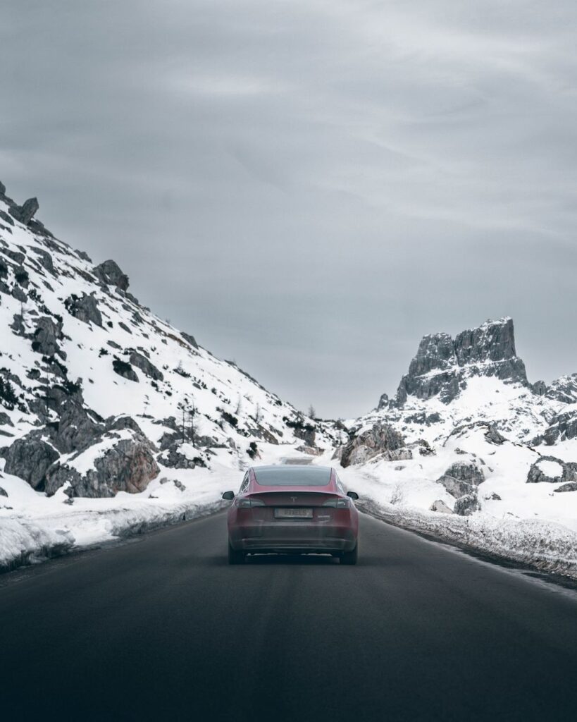 tesla car on gray asphalt road